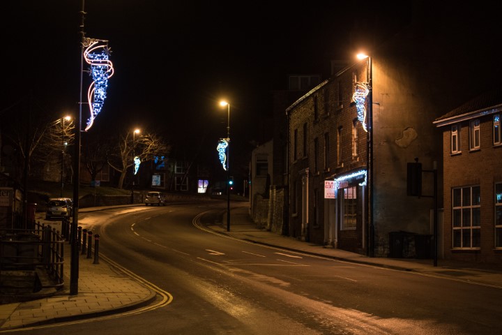 street with light flags on the streetlights